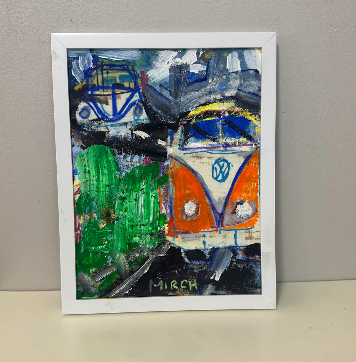 Framed original painting of an orange VW bus on a hill by Mirch